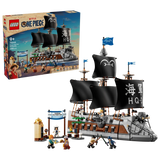 LEGO ONE PIECE Garp's Marine Battleship 75646 retail box displayed beside the completed warship with black sails, grey dog figurehead, Marine Victory Day market scene and minifigures.