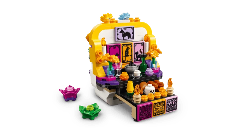 Angled view of the LEGO Altar of the Dead 40811 altar side with two small colourful builds beside it