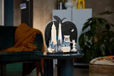 Completed LEGO Architecture New York City The Big Apple model displayed on a dark round side table in a living room