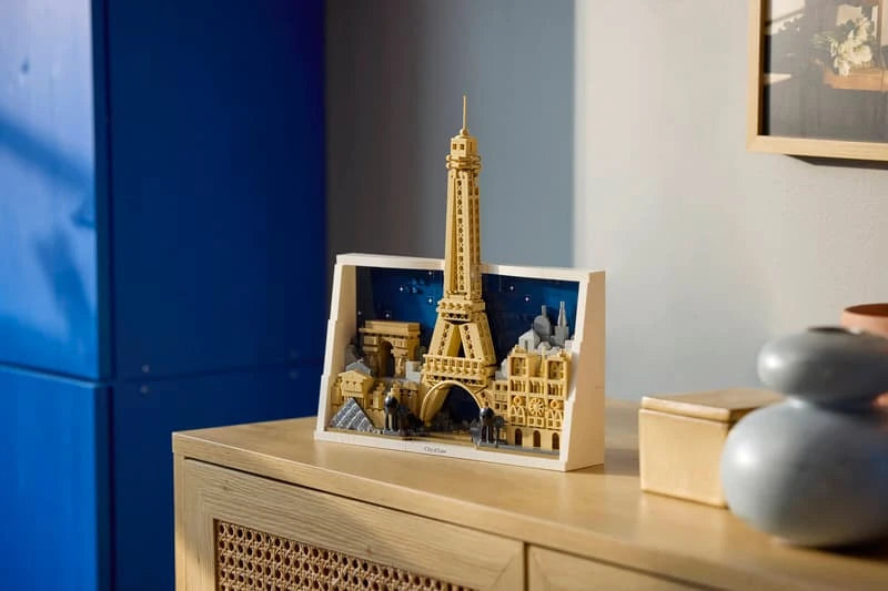 LEGO Architecture Paris City of Love model displayed on a wooden cabinet against a blue wall