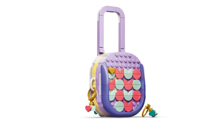 LEGO rolling suitcase build with purple handle, patterned front and key chain accessories