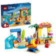LEGO Beach Fun with Lilo & Stitch box shown with the completed beach set, figures, slide, rocket ride and shops