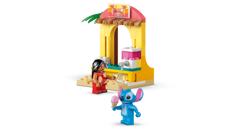 LEGO Lilo and Stitch figures beside a yellow shave ice shop with a pink and white counter