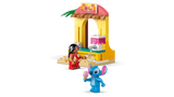 LEGO Lilo and Stitch figures beside a yellow shave ice shop with a pink and white counter