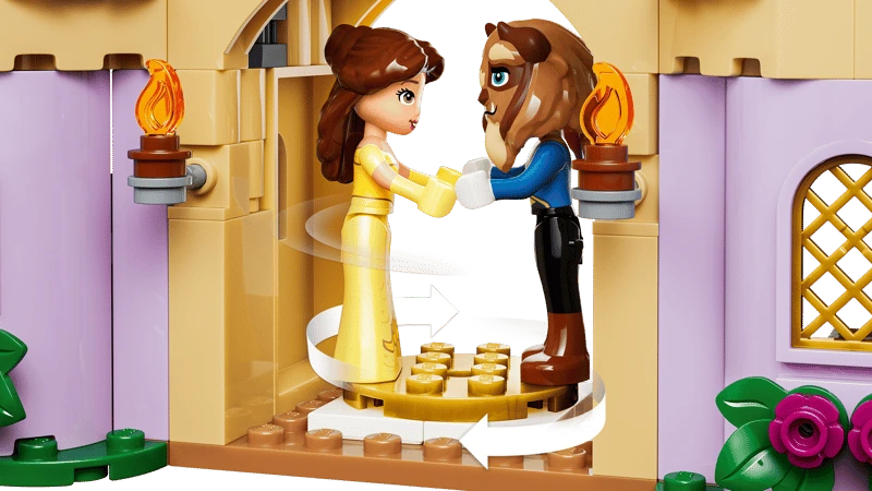 LEGO Belle and Beast figures standing inside the castle ballroom