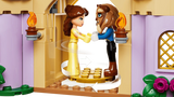 LEGO Belle and Beast figures standing inside the castle ballroom