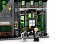 LEGO dark wizarding shop front with green windows, two minifigures and a street lamp