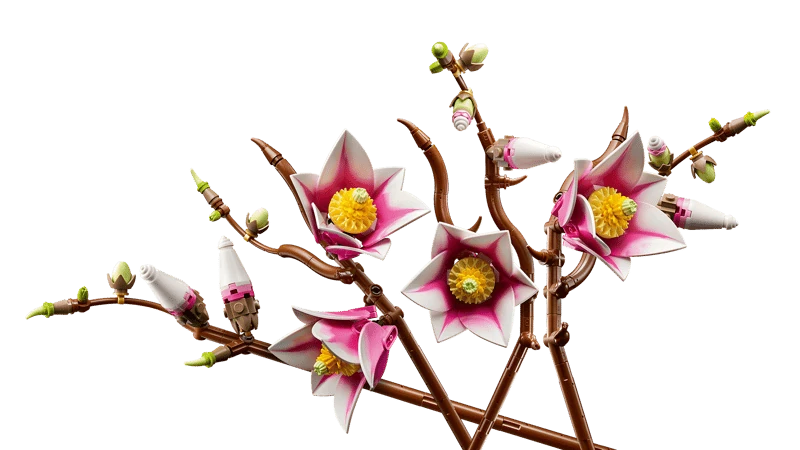 Close view of LEGO Botanicals Magnolia Branches 11510 showing open flowers with yellow centres, closed buds and brown branch details