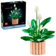 LEGO Botanicals Peace Lily with green leaves, white lily flowers at different bloom stages, peach coloured plant pot, and retail box shown on a white background
