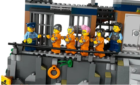 LEGO City 60419 prison breakout scene with officers escorting prisoners along the cell walkway on white background in Ireland