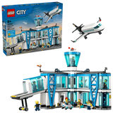 LEGO City Airport with Airplane box beside the completed airport terminal and passenger airplane model