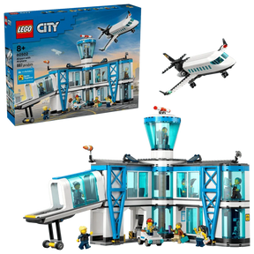 LEGO City Airport with Airplane box beside the completed airport terminal and passenger airplane model