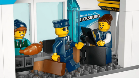 LEGO City airport check-in counter with airline staff minifigure, pilot minifigure and passenger luggage