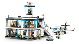LEGO City airport terminal with passenger airplane, airport tug, jet bridge, minifigures and luggage