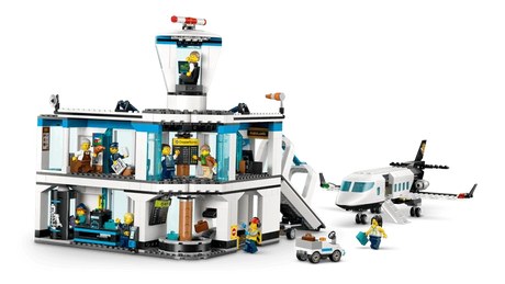 LEGO City airport terminal with passenger airplane, airport tug, jet bridge, minifigures and luggage