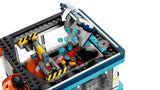 LEGO City drive-through car wash with blue water pieces falling onto a red car between orange brushes