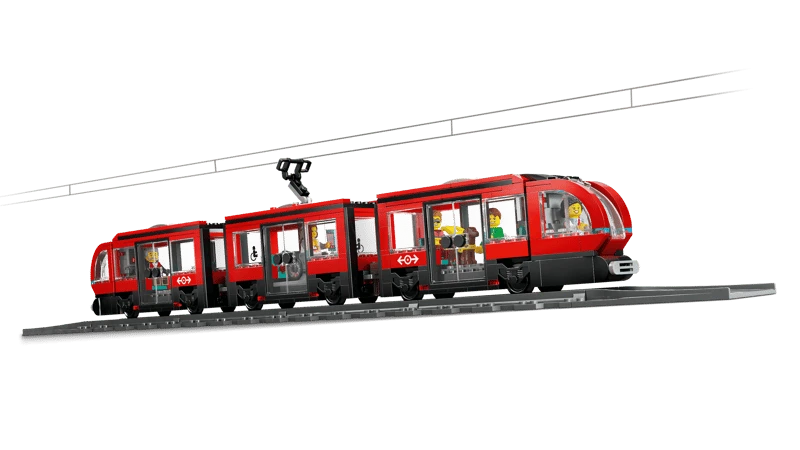 LEGO City red streetcar shown side on with overhead tram line and minifigures inside