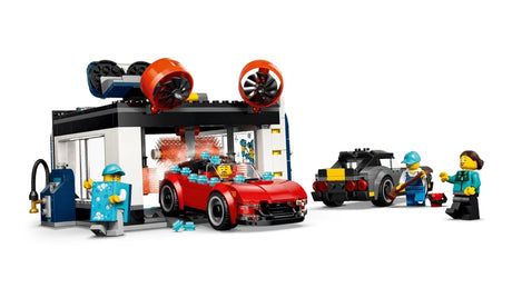 LEGO City car wash building with red convertible, black and yellow car, minifigures, blue vacuum station and orange brushes