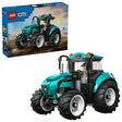 LEGO City Farm Tractor 60498 shown with retail box and assembled teal tractor featuring enclosed cab, front grille, exhaust pipe and four large black rubber tyres
