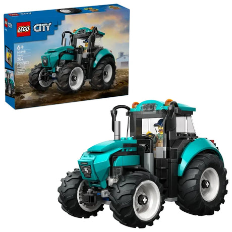 LEGO City Farm Tractor 60498 shown with retail box and assembled teal tractor featuring enclosed cab, front grille, exhaust pipe and four large black rubber tyres
