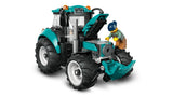 Front angled view of LEGO City Farm Tractor 60498 with hood open revealing engine detail, teal body panels, cab structure and farmer minifigure positioned beside the tractor