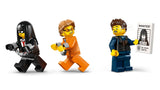 Close up view of three LEGO City minifigures including a police officer holding a wanted poster and two prisoners in different outfits