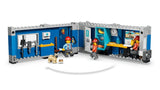 LEGO City site office interior with worker minifigures, dog figure, meeting table, kitchen area and toilet