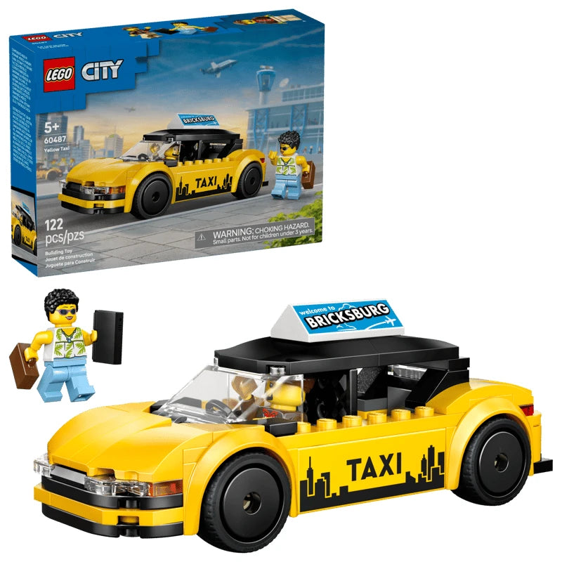 LEGO City yellow taxi model shown in front of the LEGO City retail box, with black roof, white roof sign reading “BRICKSBURG”, black wheels, TAXI text and skyline graphic on the side, and a minifigure standing beside the front of the car with suitcases.