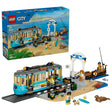 LEGO City Classic Beach Streetcar box beside built streetcar, station, pier, minifigures and seal figure