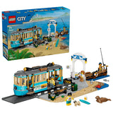 LEGO City Classic Beach Streetcar box beside built streetcar, station, pier, minifigures and seal figure