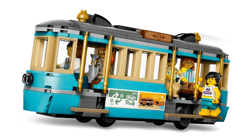 LEGO teal and cream streetcar model with minifigures inside and a passenger minifigure on the step