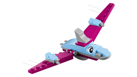 Close-up of pink flying dinosaur from LEGO Classic Creative Dinosaurs 11041 with outstretched wings, large eyes and white curved details