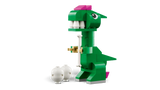 Green LEGO Classic Creative Dinosaurs T. rex model with white teeth, pink head details, short arms and a white dinosaur egg