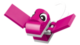 Close-up of pink flying dinosaur from LEGO Classic Creative Dinosaurs 11041 with outstretched wings, large eyes and white curved details
