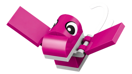 Close-up of pink flying dinosaur from LEGO Classic Creative Dinosaurs 11041 with outstretched wings, large eyes and white curved details