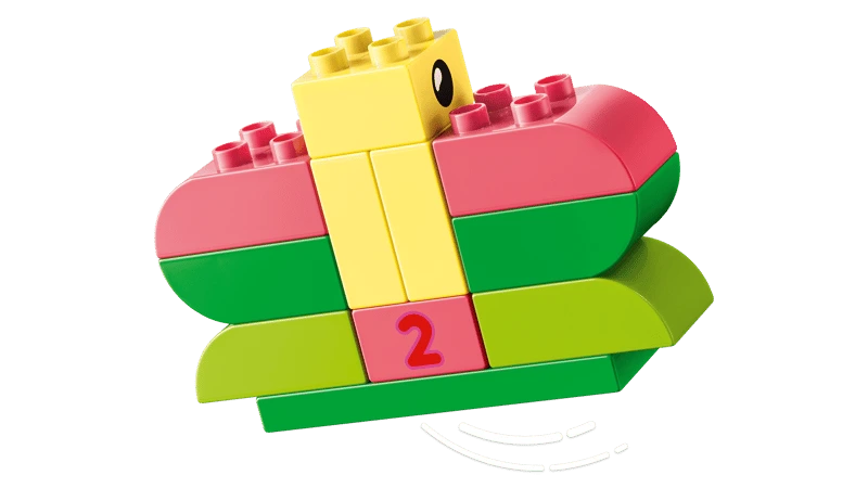 LEGO DUPLO yellow duck build on curved green and pink bricks with a number 2 block