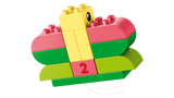 LEGO DUPLO yellow duck build on curved green and pink bricks with a number 2 block