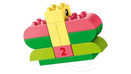 LEGO DUPLO yellow duck build on curved green and pink bricks with a number 2 block