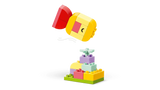 LEGO DUPLO spinning top build above a small flower base build