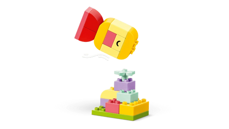 LEGO DUPLO spinning top build above a small flower base build