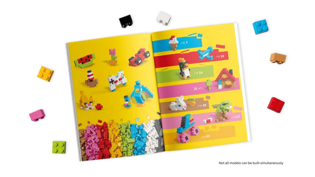 LEGO building instructions booklet with loose bricks around it