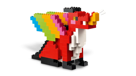 LEGO dragon build with red body, black legs and rainbow coloured wings