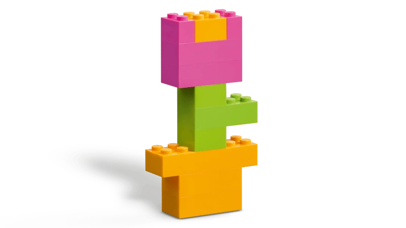LEGO flower build with pink petals, green stem and orange pot