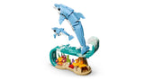 LEGO Creator 3 in 1 Sea Animals Beautiful Dolphins adult and baby dolphin models shown riding a wave on white background
