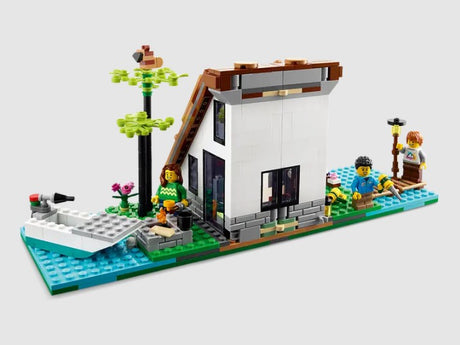 Rear view of LEGO Cozy House alternate build with characters by the lake – Ireland