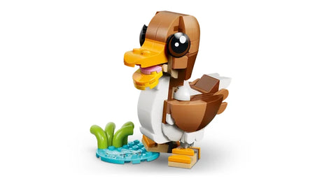 LEGO Creator duck model standing beside a small pond build