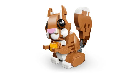 LEGO Creator squirrel model holding a yellow acorn with raised tail