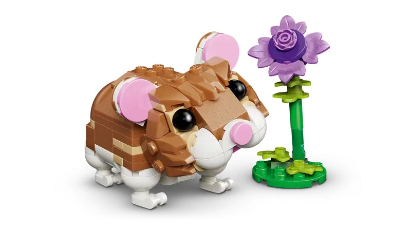 LEGO Creator Cute Hamster With Flower 31376 front view of hamster figure beside a purple flower