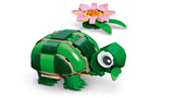 LEGO Creator Turtle With a Water Lily Flower 31377 full set with box and assembled green turtle figure next to pink water lily flower
