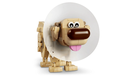 LEGO Disney Dug dog figure wearing a large white protective cone around his neck, showing his tan body, brown nose, wide eyes and pink tongue.